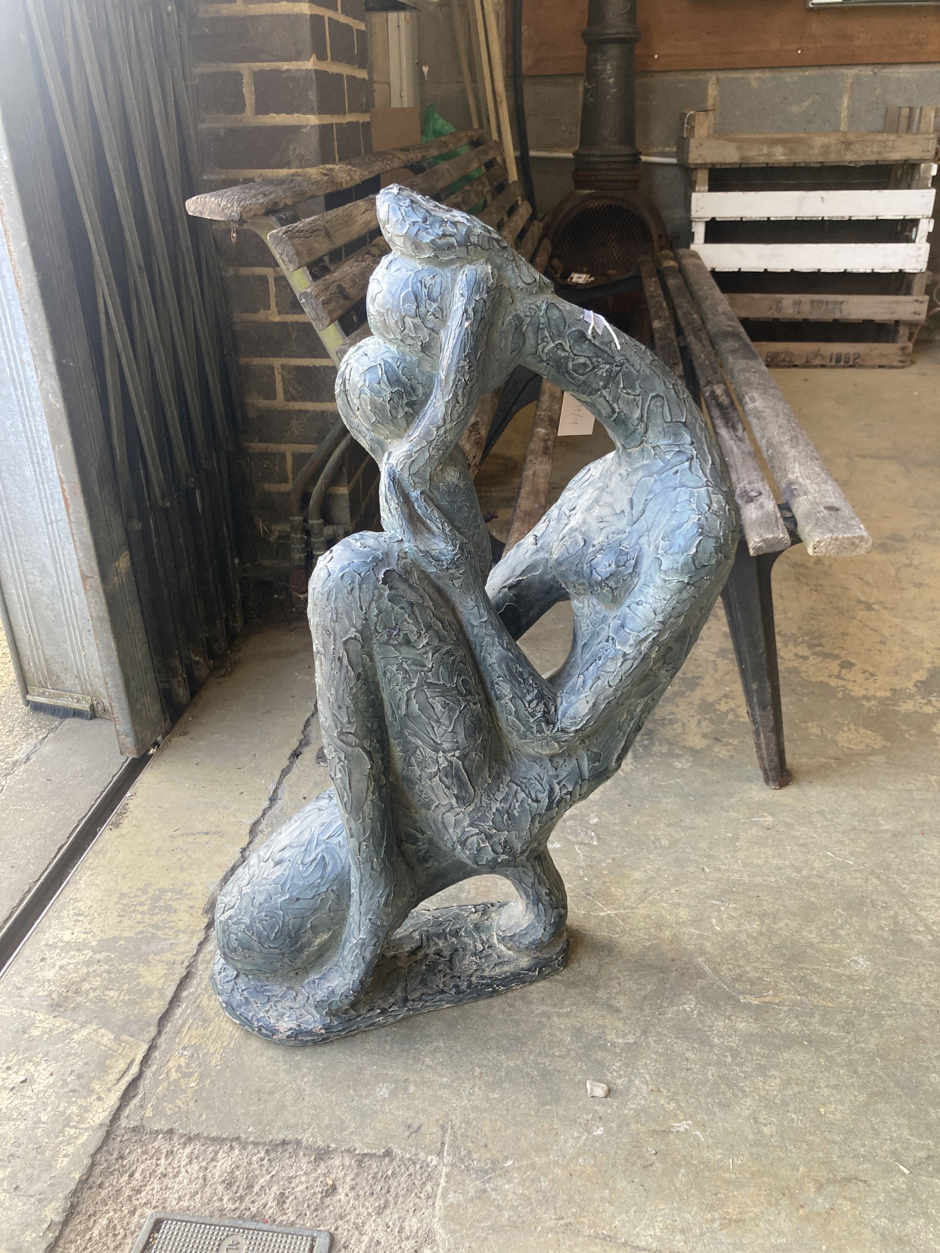 An Austin sculpture Durastone figure of a crouching girl